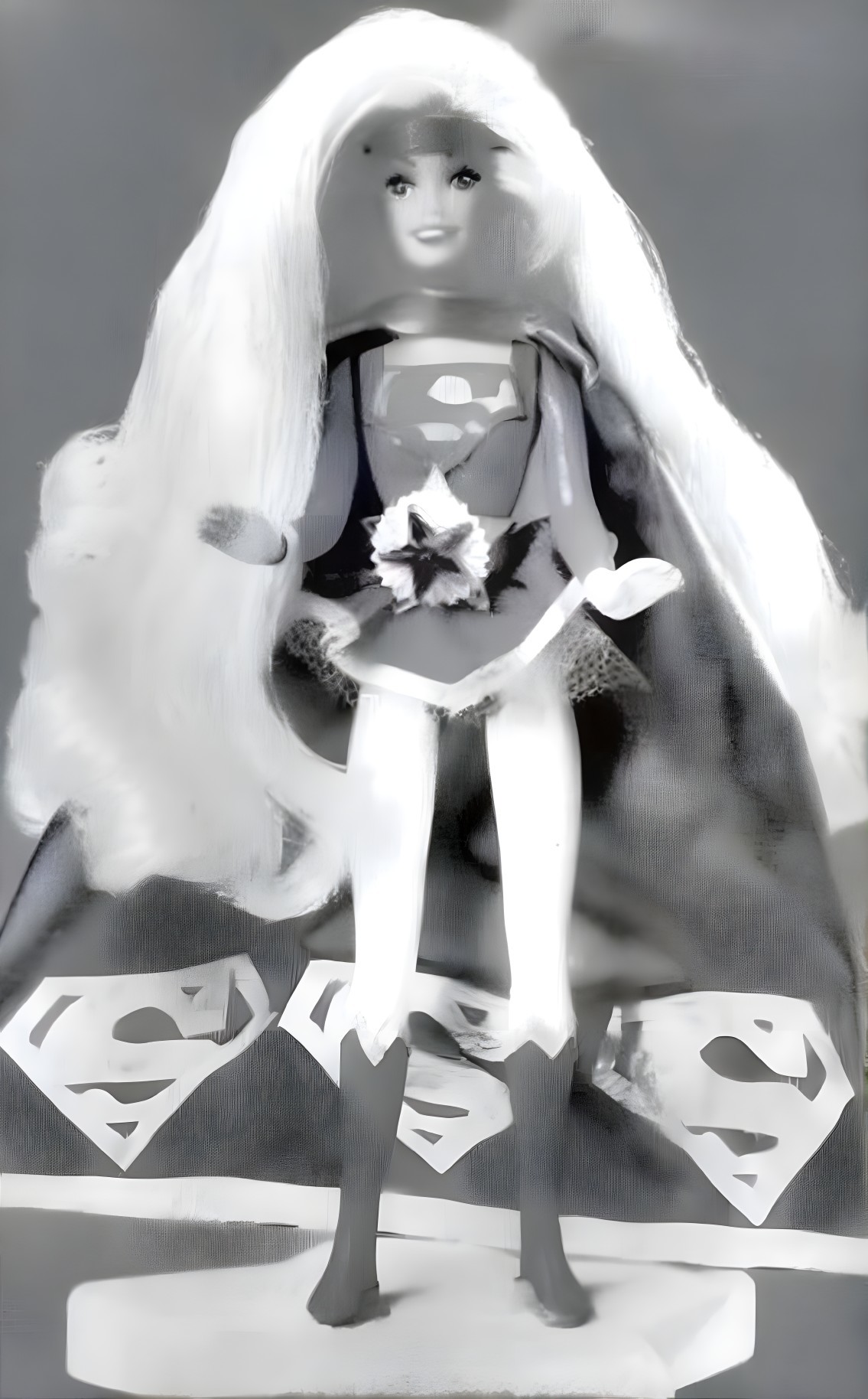 Vintage superhero doll in blue and red costume