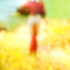 Young Woman in Red Swimsuit on Grassy Hillside