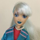 Fashion doll with silver hair and turquoise jacket