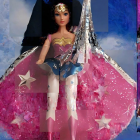 Stylish superhero doll in vibrant outfit with cape