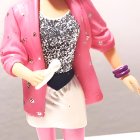 Stylish doll in pink blazer and 80s-inspired outfit