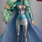 Stylish doll with mint-green hair and futuristic outfit