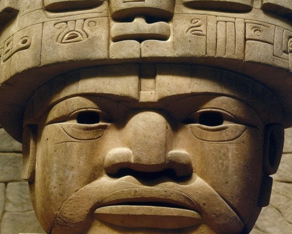Large Stone Head Sculpture with Intricate Carvings