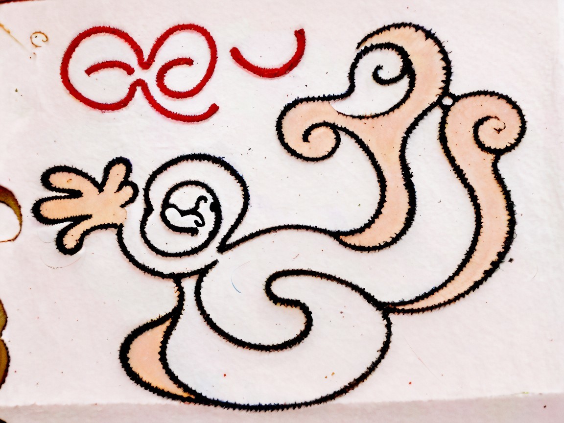 Textured White Surface with Cartoonish Creature Drawing