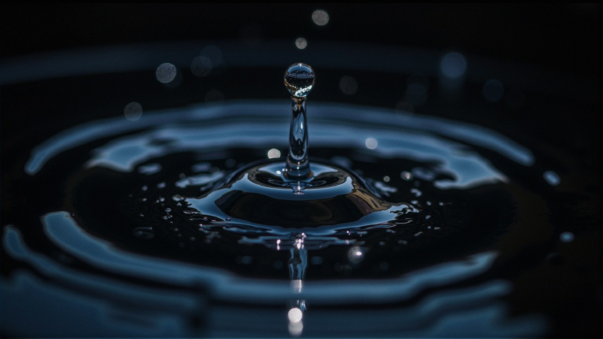 Water Droplet Splashing on Dark Reflective Surface