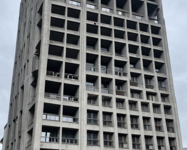 Brutalist Concrete Building with Grid Facade and Windows