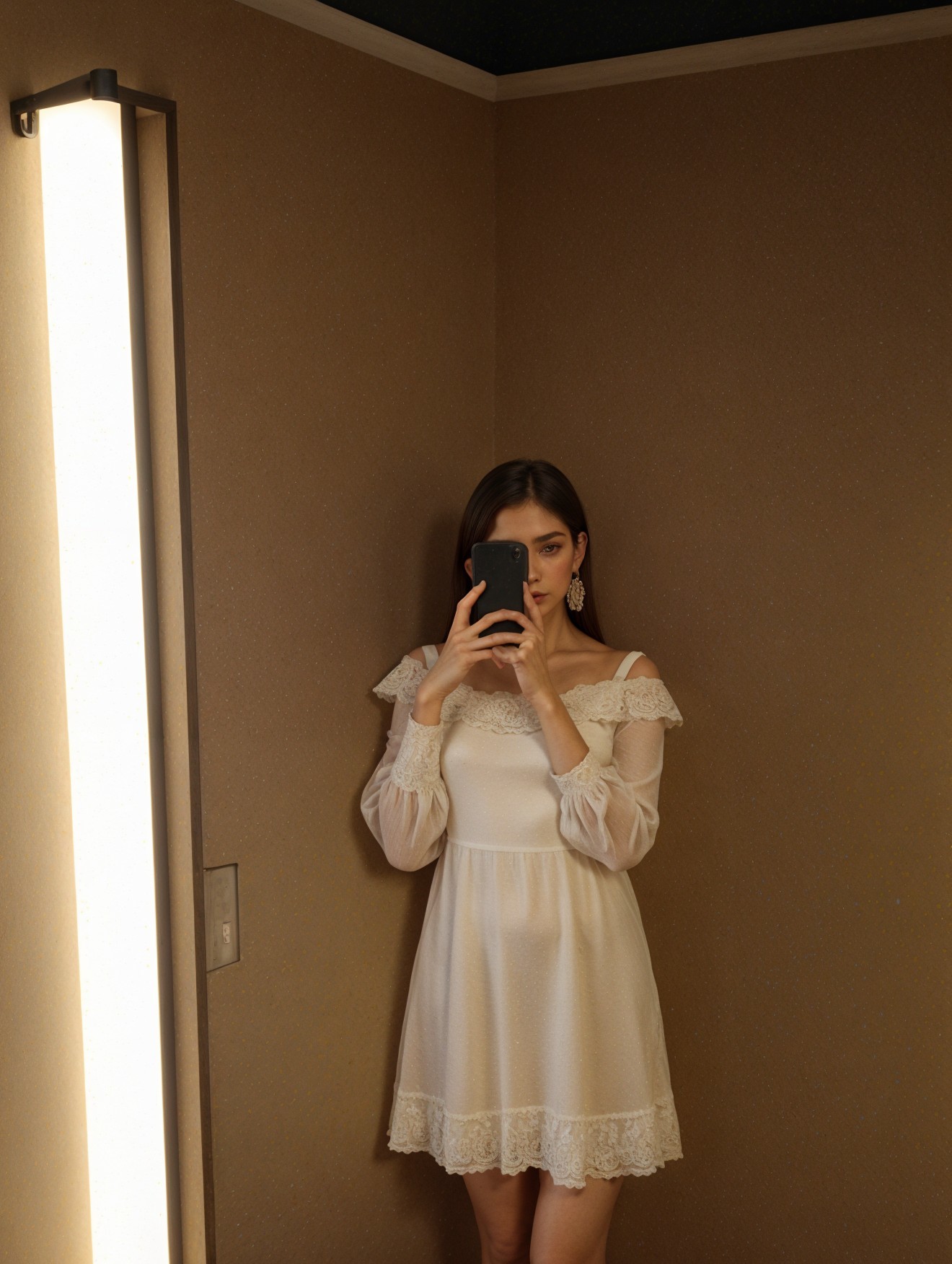 Woman in lace dress captures reflection in mirror