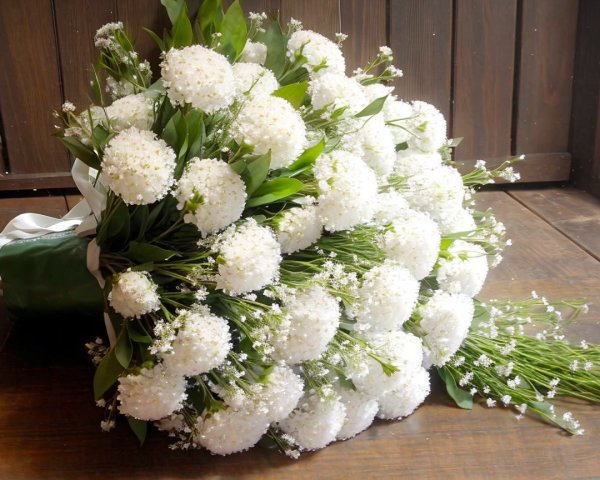 Elegant Bouquet of White Flowers with Green Foliage