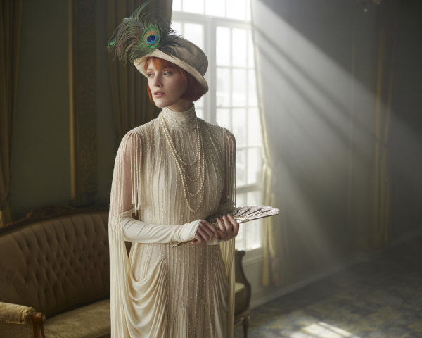 Elegant Woman in Vintage Room with Ivory Gown