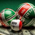 Colorful Lottery Balls on Dollar Bills Background