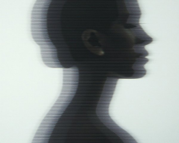 Silhouette of a woman with layered ghostly profiles