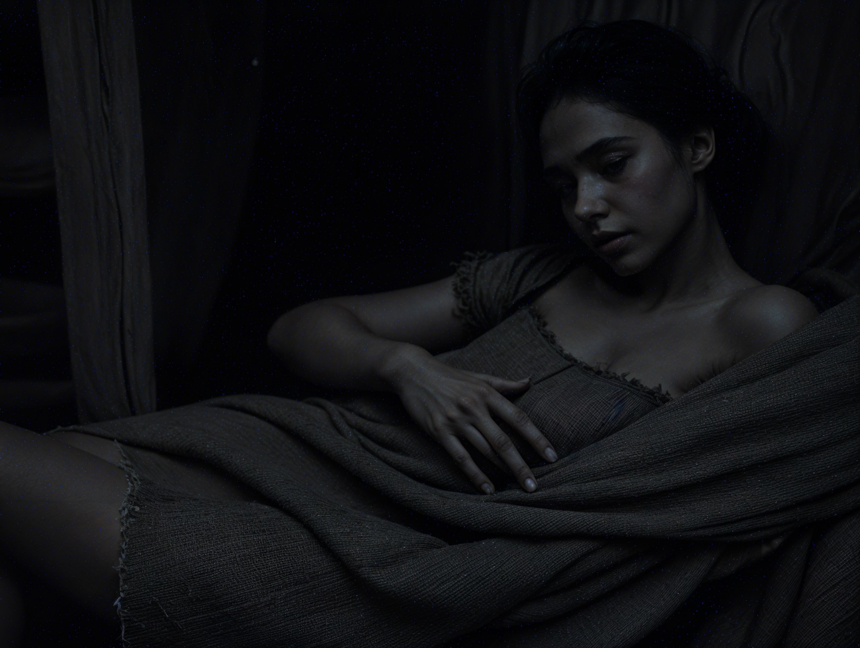 Contemplative Young Woman in Dimly Lit Space