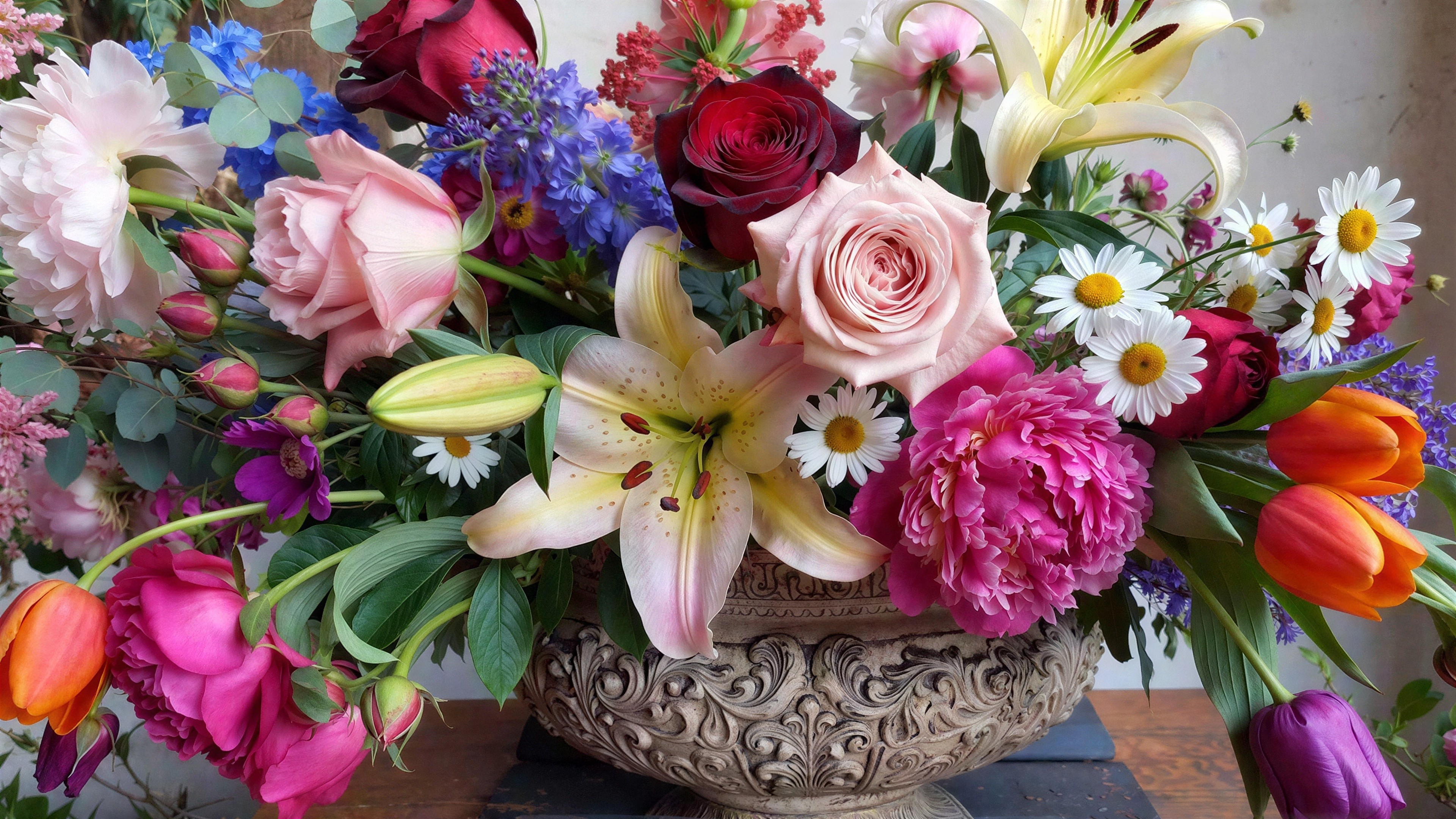 Floral Arrangement in Ornate Stone Vase with Varied Blooms