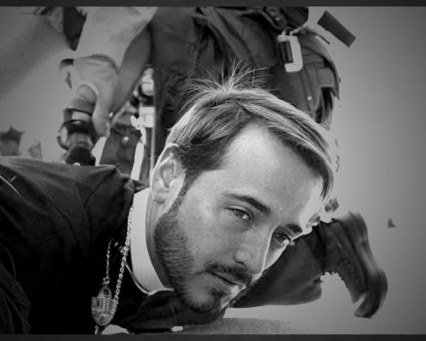 Clerical Figure Restrained by Law Enforcement Officers