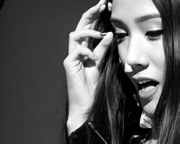 Close-Up Black-and-White Image of a Young Performer