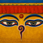 Vibrant Mural with Stylized Eyes and Spiral Symbol