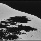 Surreal Black and White Desert Night Scene with Eyes