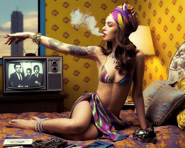 Young Woman in Retro Bikini and Turban on Bed