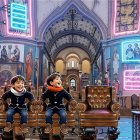 Joyful Boys in Colorful Scarves in Fantastical Church