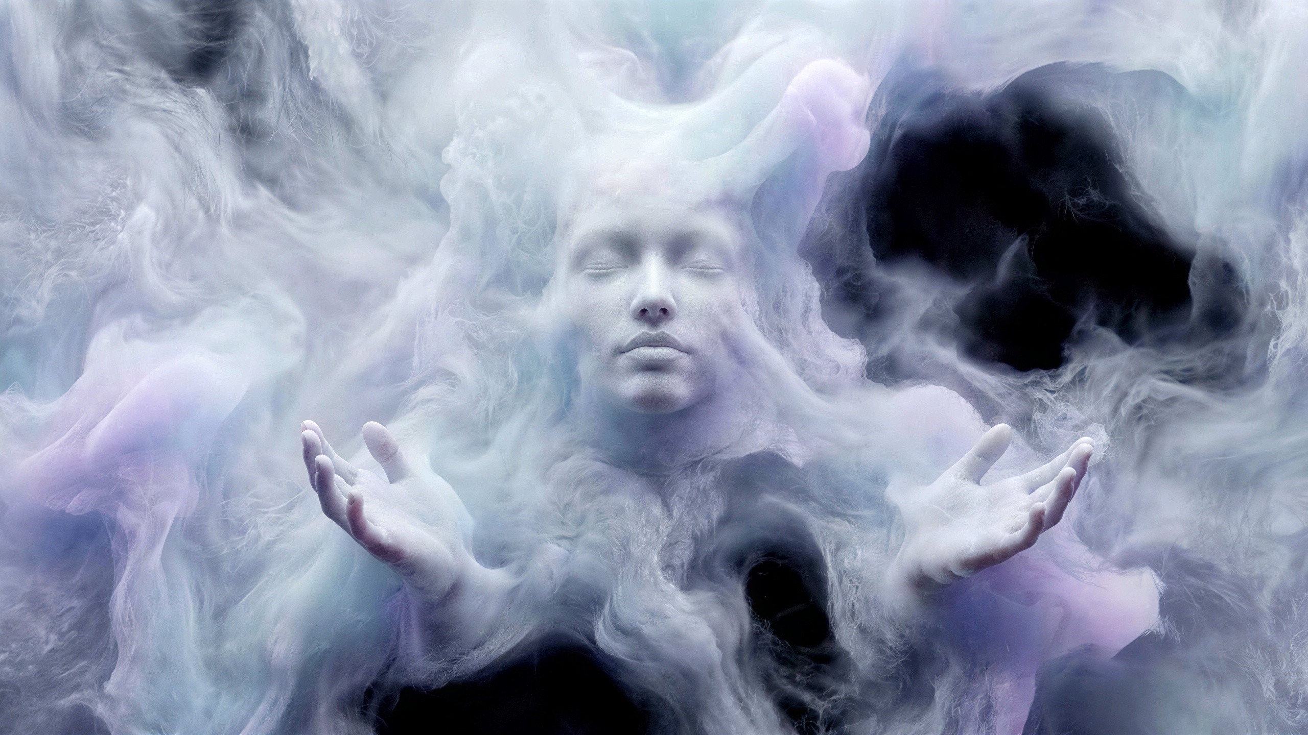Close-Up of Serene Figure in Colorful Smoke Vortex