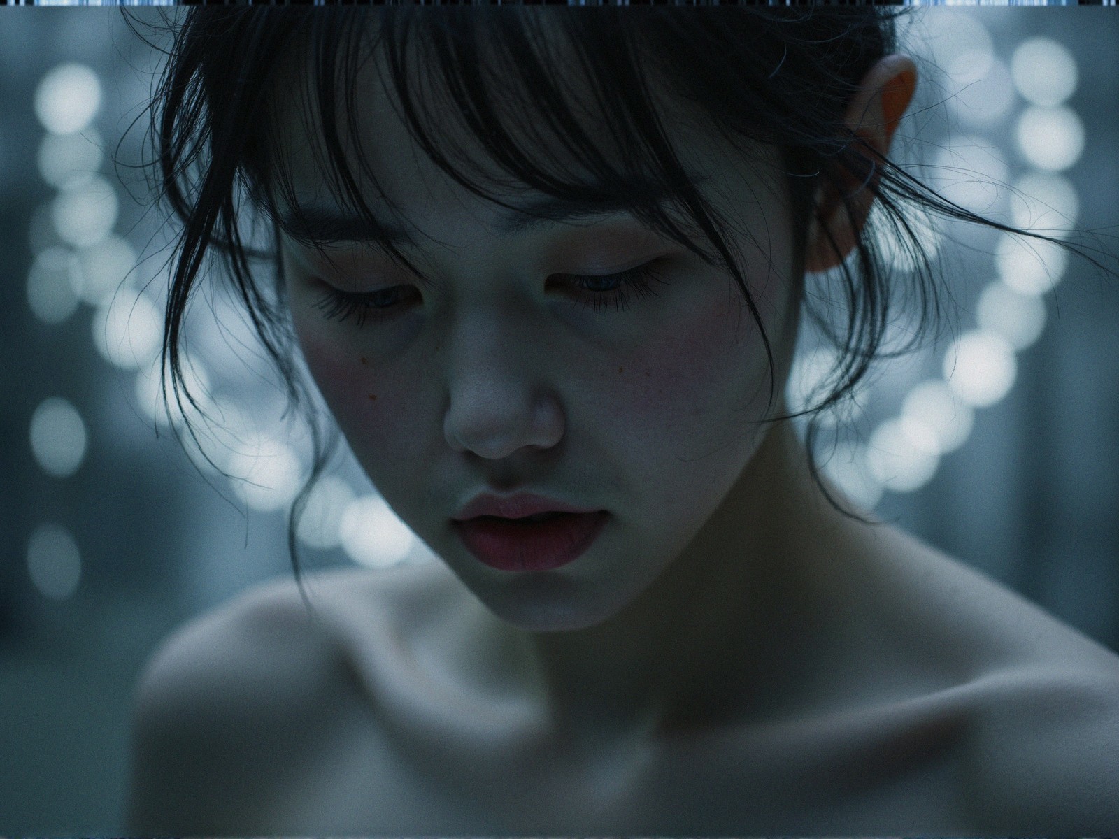 Close-Up Portrait of a Young Woman in Soft Light