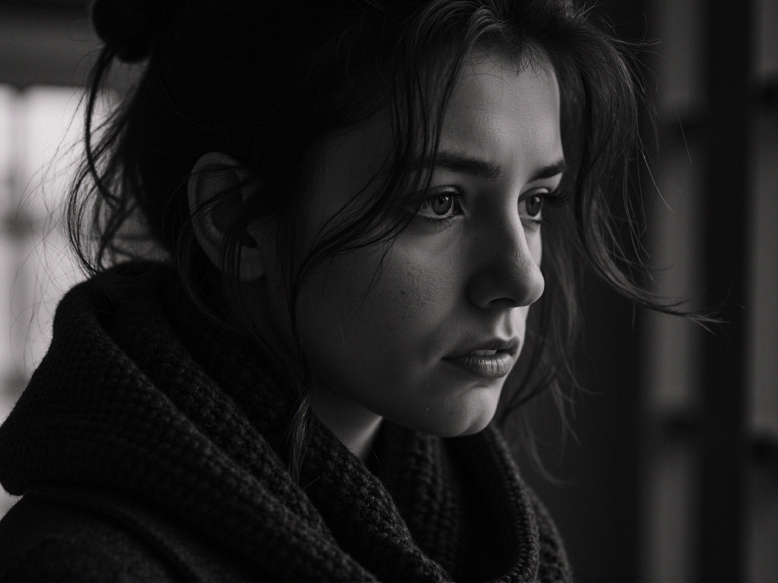 Close-up of a Young Woman in Contemplative Profile