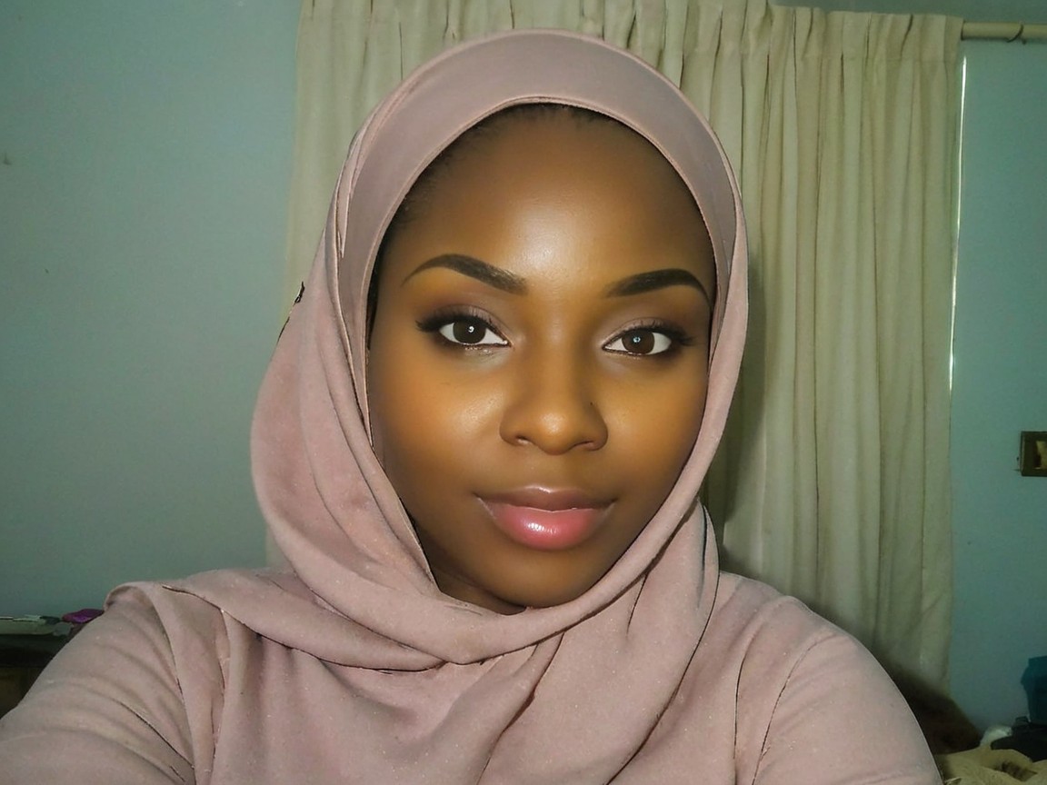 Portrait of a Young Woman in Soft Pink Hijab