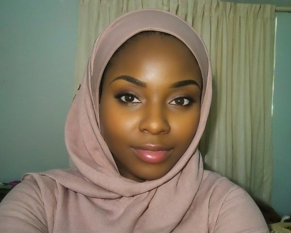 Portrait of a Young Woman in Soft Pink Hijab