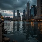 Cityscape at Dusk with Skyscrapers and River Reflection