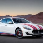 Modern Car Against Vibrant Abstract Backdrop