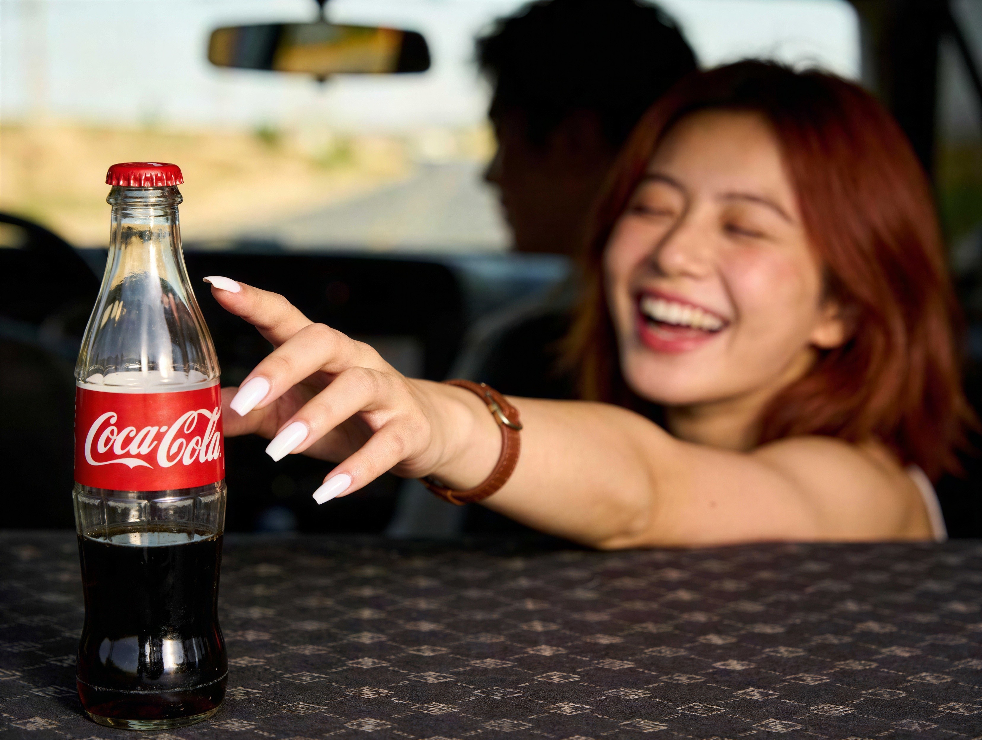 Smiling Woman Reaching for Coca-Cola Bottle in Focus
