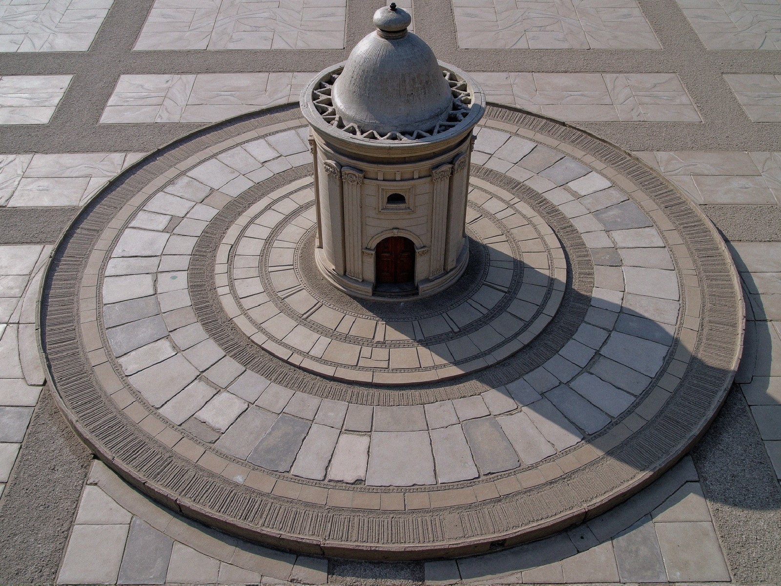 Circular Stone Structure on Patterned Plaza
