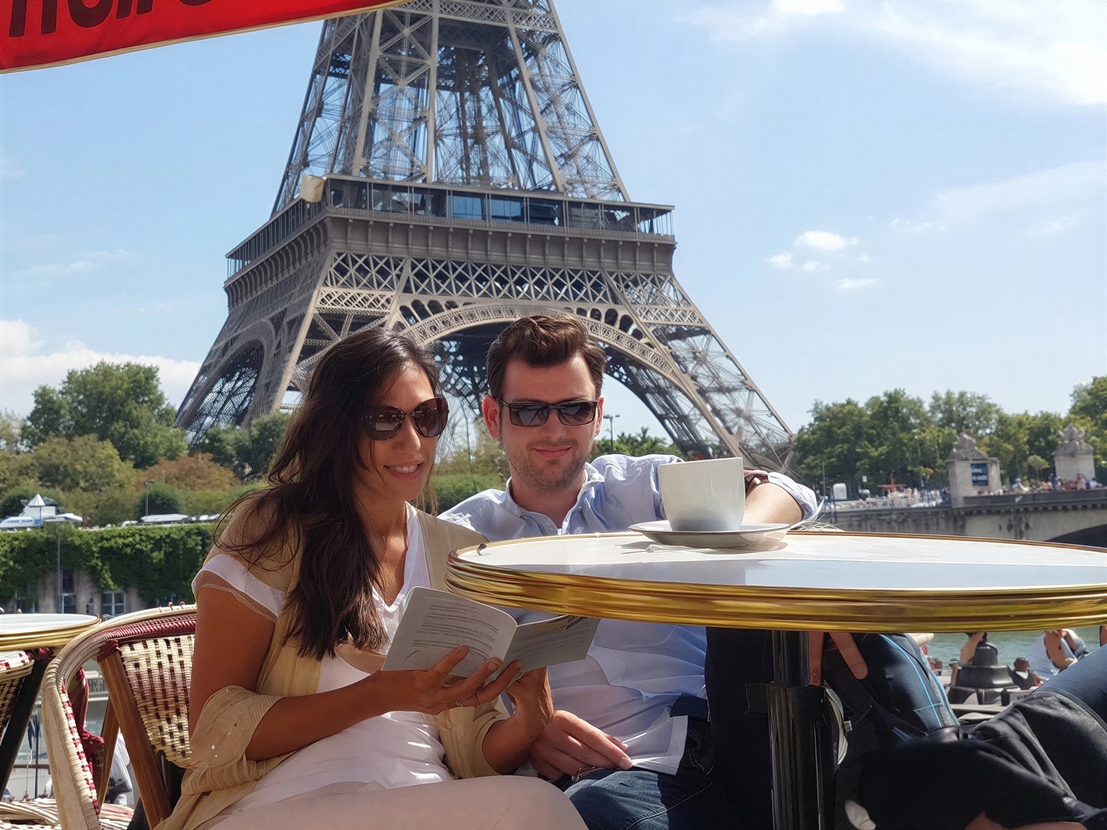 Couple at White and Gold Table Near Eiffel Tower
