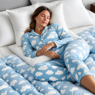 Woman Sleeping in Cloud-Patterned Pajamas and Bedding