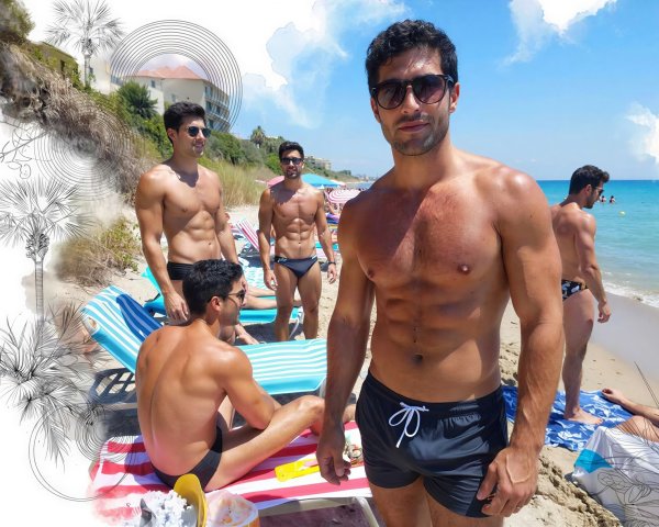 Group of Shirtless Men at a Beach with Blue Water
