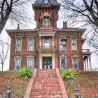 Victorian Mansion with Red Brick Exterior and Gardens