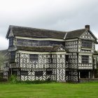 Historic Half-Timbered House with Lush Greenery