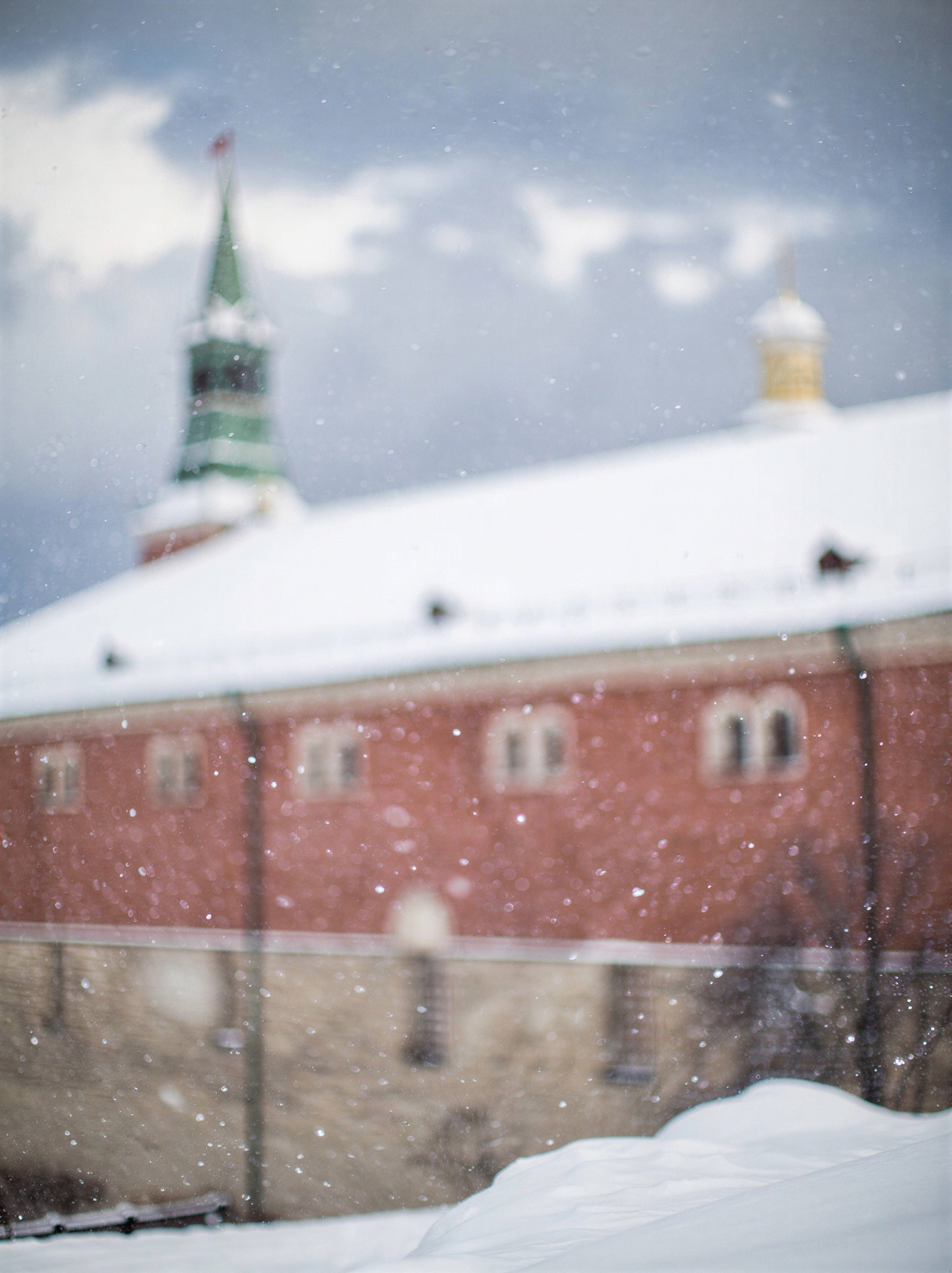 Blurry Low Angle View of Snow-Covered Building