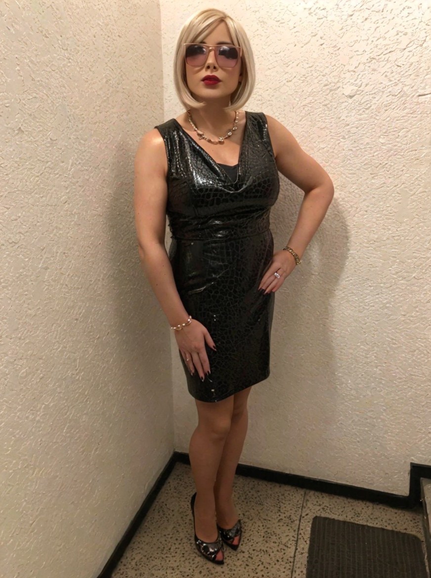 Confident Individual in Stylish Black Dress and Accessories