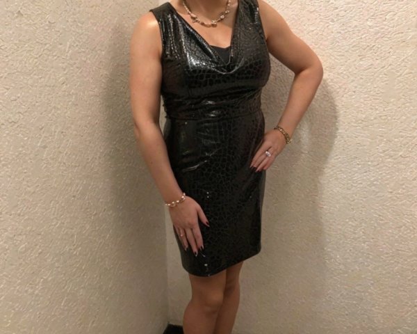 Confident Individual in Stylish Black Dress and Accessories