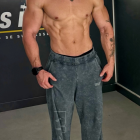 Full-body painting of a shirtless muscular man