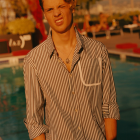 Young man in autumn setting with vibrant hair highlights