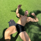 Muscular Male Figure on Vibrant Green Surface