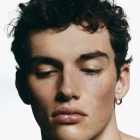 Close-Up Portrait of a Man with Dark Wavy Hair