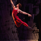 Dynamic Athlete in Motion Against Abstract Background