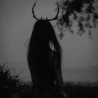 Portrait of a Person with Long Hair and Dramatic Lighting