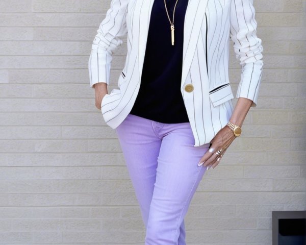 Stylish Woman in White Blazer and Pastel Jeans
