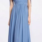 Elegant woman in light blue evening dress with embellishments