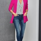 Fashionable woman in pink blazer and blue jeans