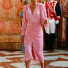 Stylish Woman in Pink Dress in Luxurious Interior